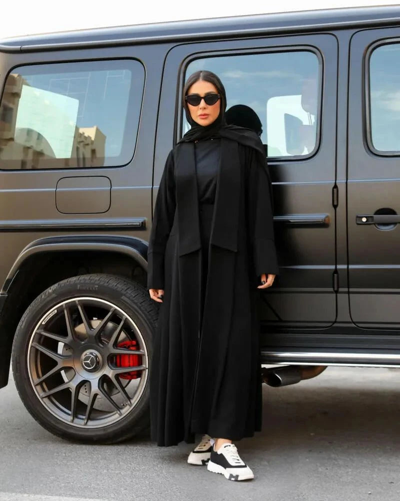 Flowline modern black crepe abaya with blazer-style top, gathered wide pleats, hood, and casual tailored design