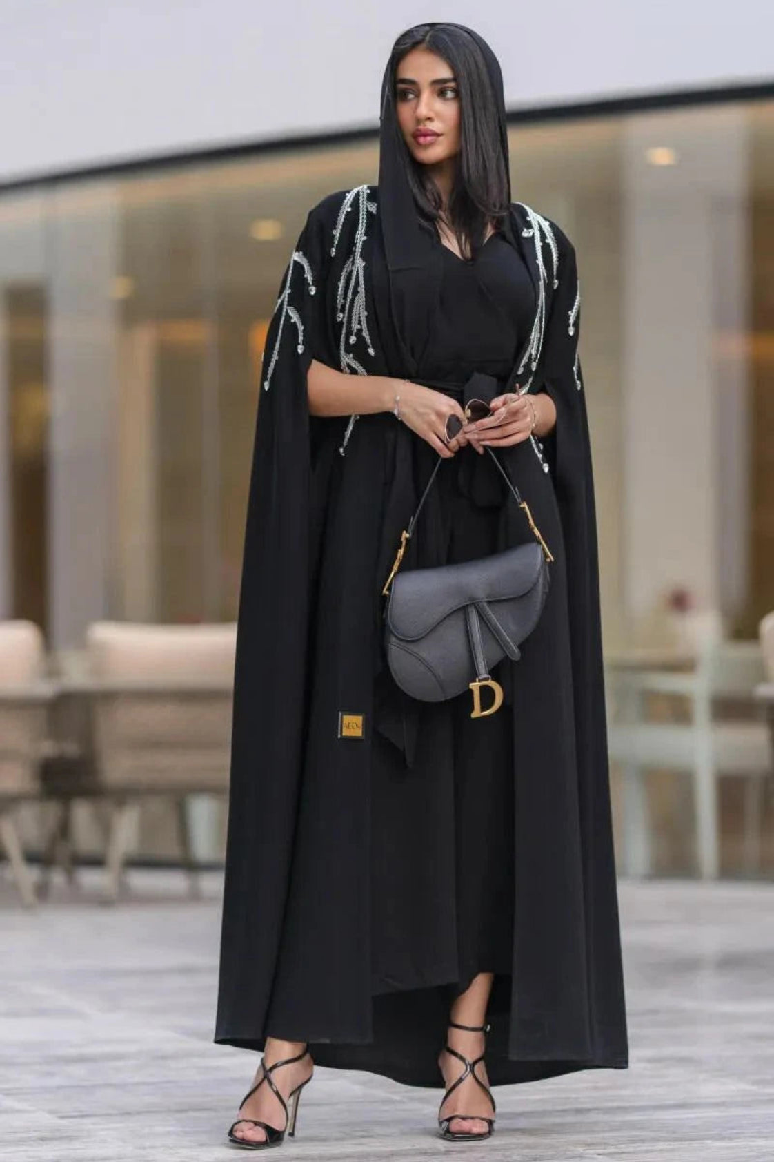 Elegant black cape abaya with silver cascading embroidery and flowing open front design