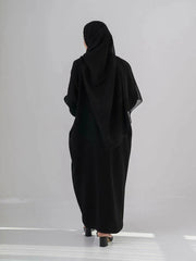 Elegant black abaya with subtle front embroidery, made from high-quality crepe for year-round comfort and versatile wear