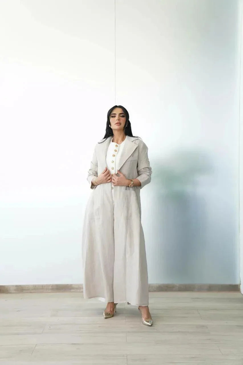 woman wearing a tailored beige linen blazer with front pockets for casual chic and workwear