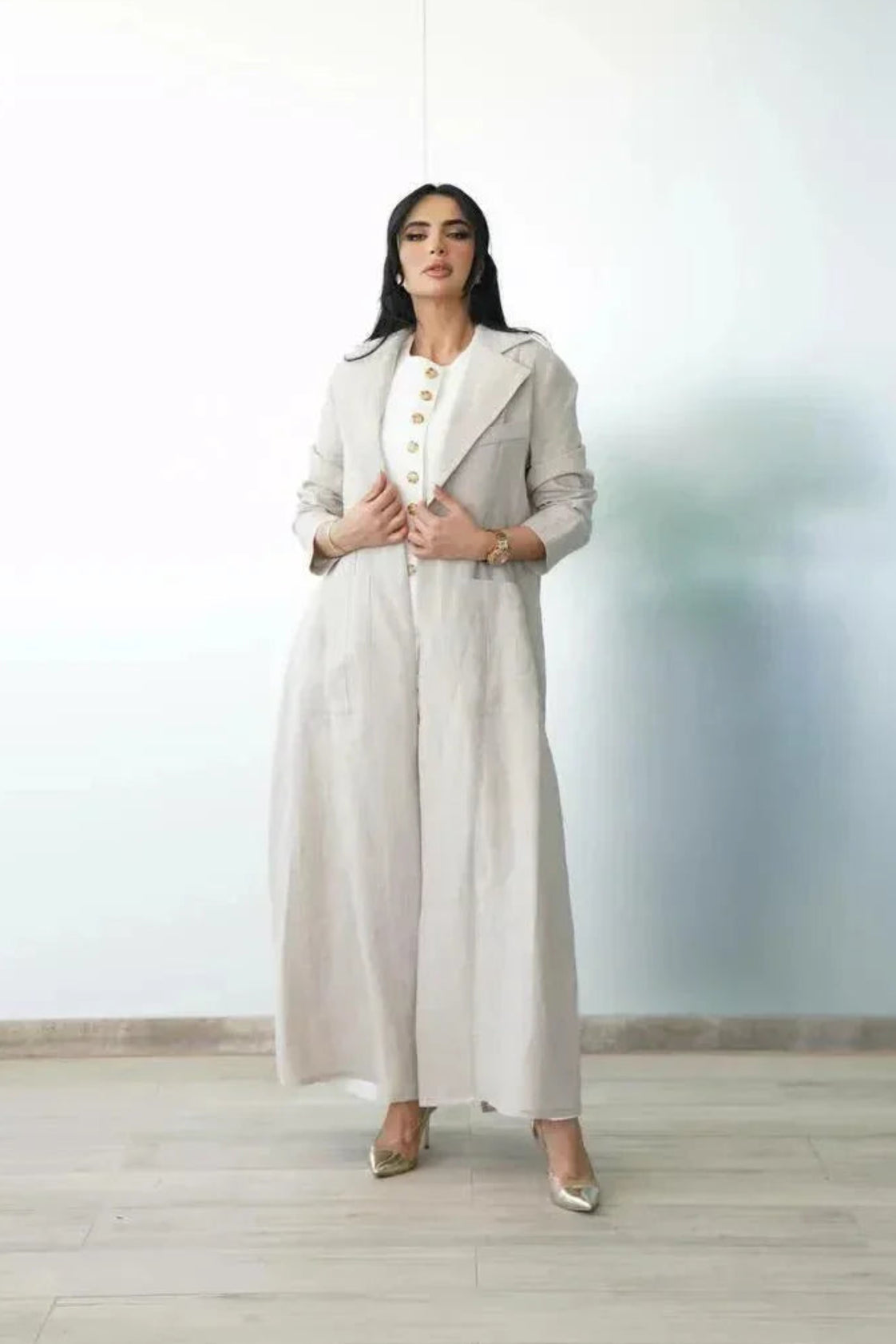 woman wearing a tailored beige linen blazer with front pockets for casual chic and workwear