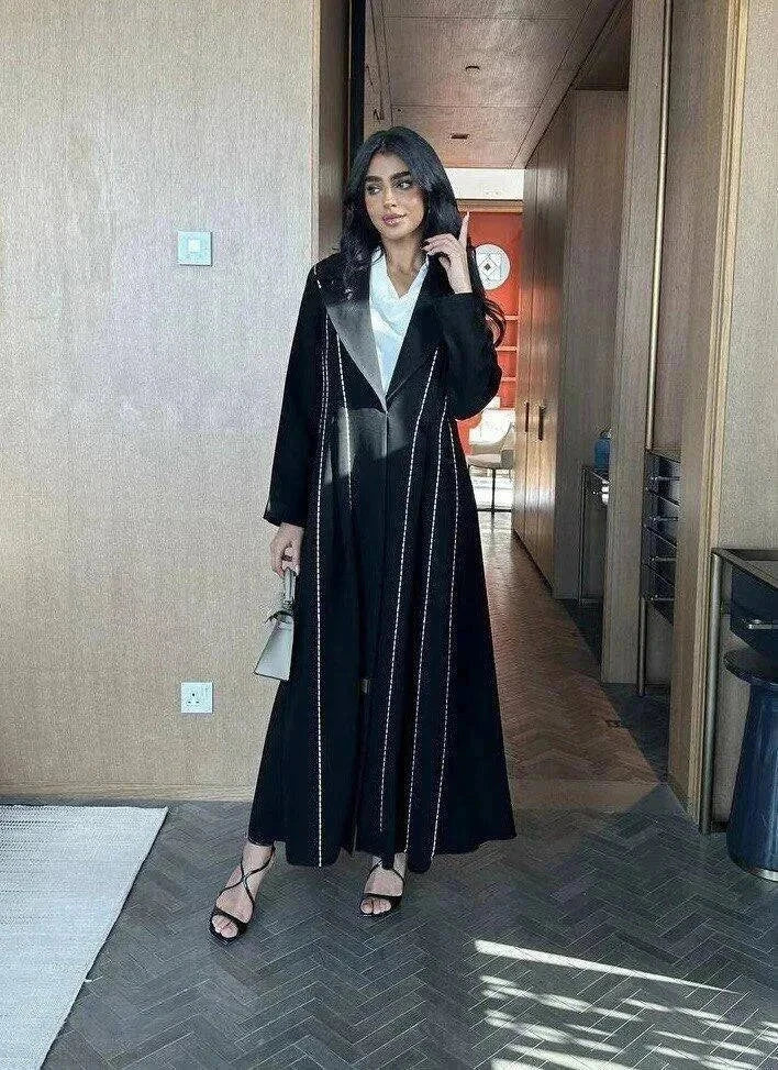 Modern black abaya with white line detailing in soft crepe fabric for everyday wear