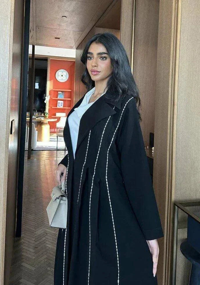 Modern black abaya with white line detailing in soft crepe fabric for everyday wear
