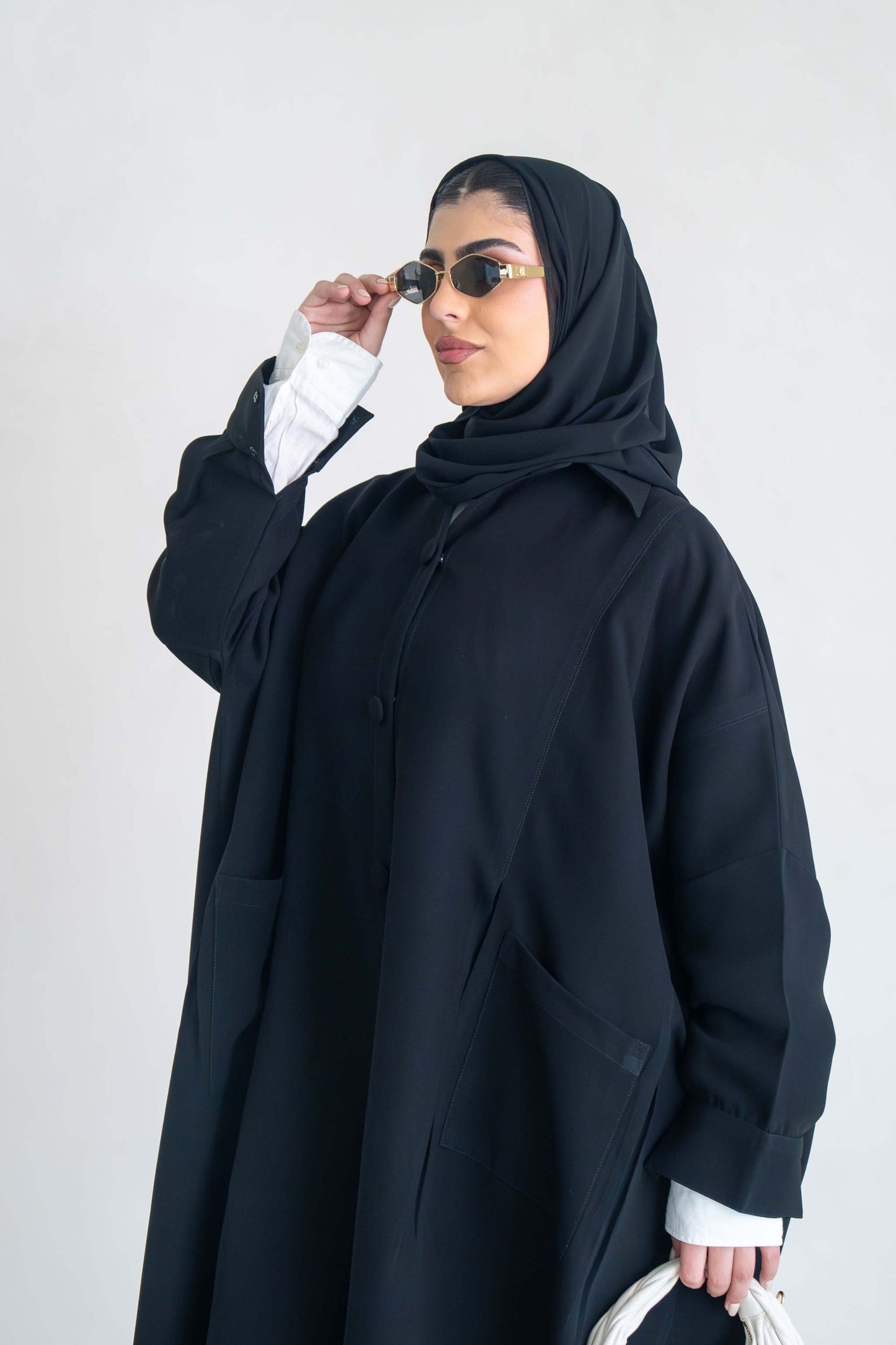 luxurious black crepe abaya with loose fit and elegant design for formal and everyday wear