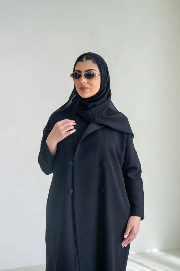 sleek black abaya with two-button front closure and soft mokado lining for everyday elegance