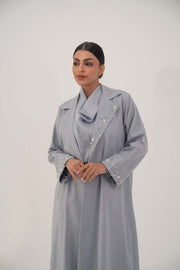 Lightweight soft blue-gray blazer-style abaya with white bead and crystal embellished wide lapel and cuffs.