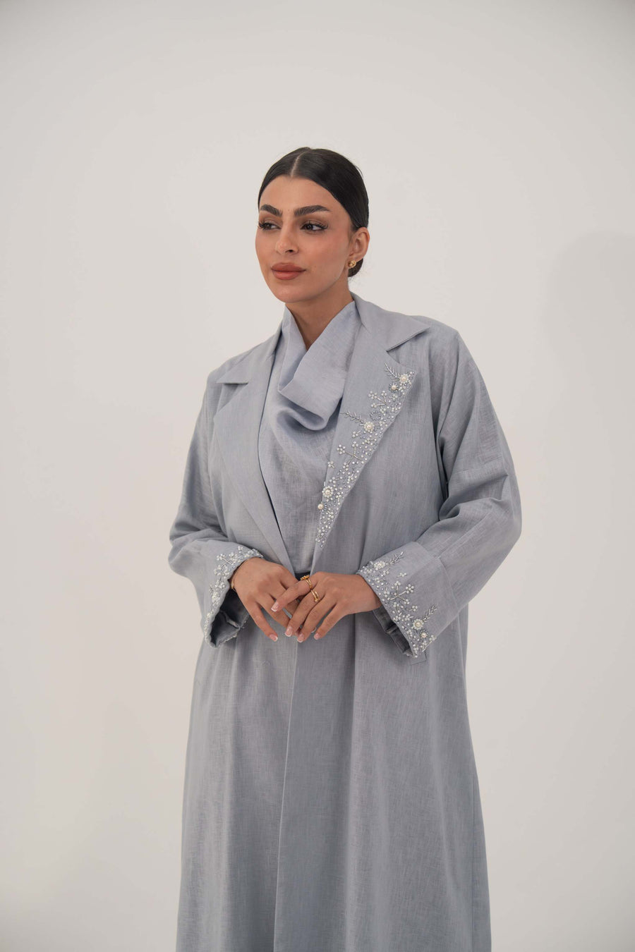 Lightweight soft blue-gray blazer-style abaya with white bead and crystal embellished wide lapel and cuffs.