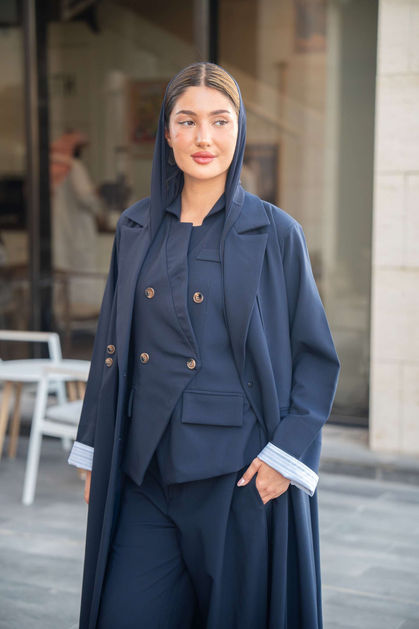 801 navy blue abaya with matching blazer and pants worn by woman