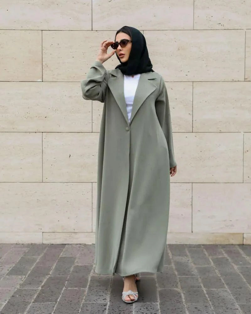 Sage green Palmis abaya with structured lapel collar and single front button made from flowy crepe fabric for modest daily wear