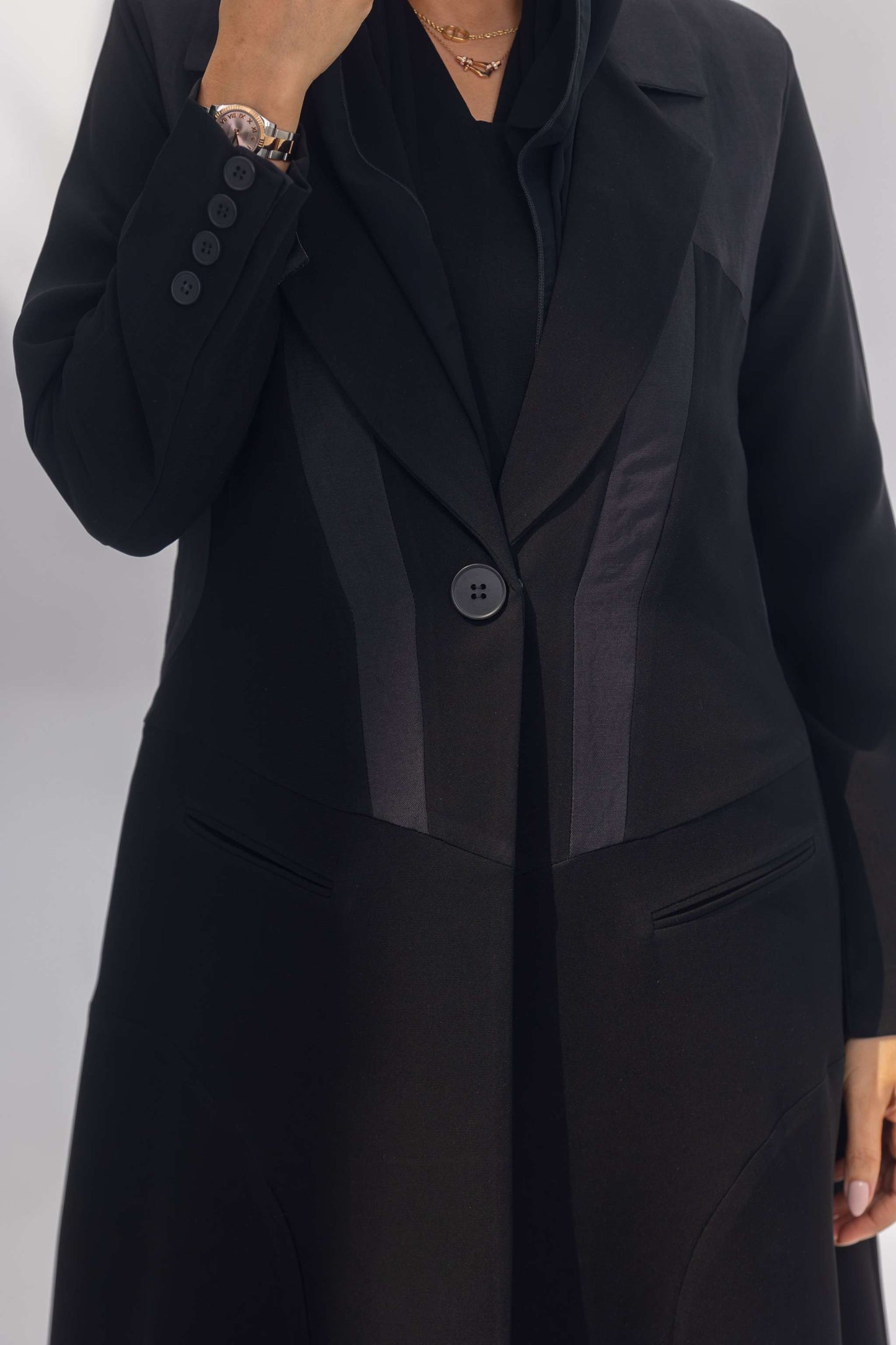 Black crepe front-open abaya with dark grey fabric accents and silk lining for a sleek, modest look