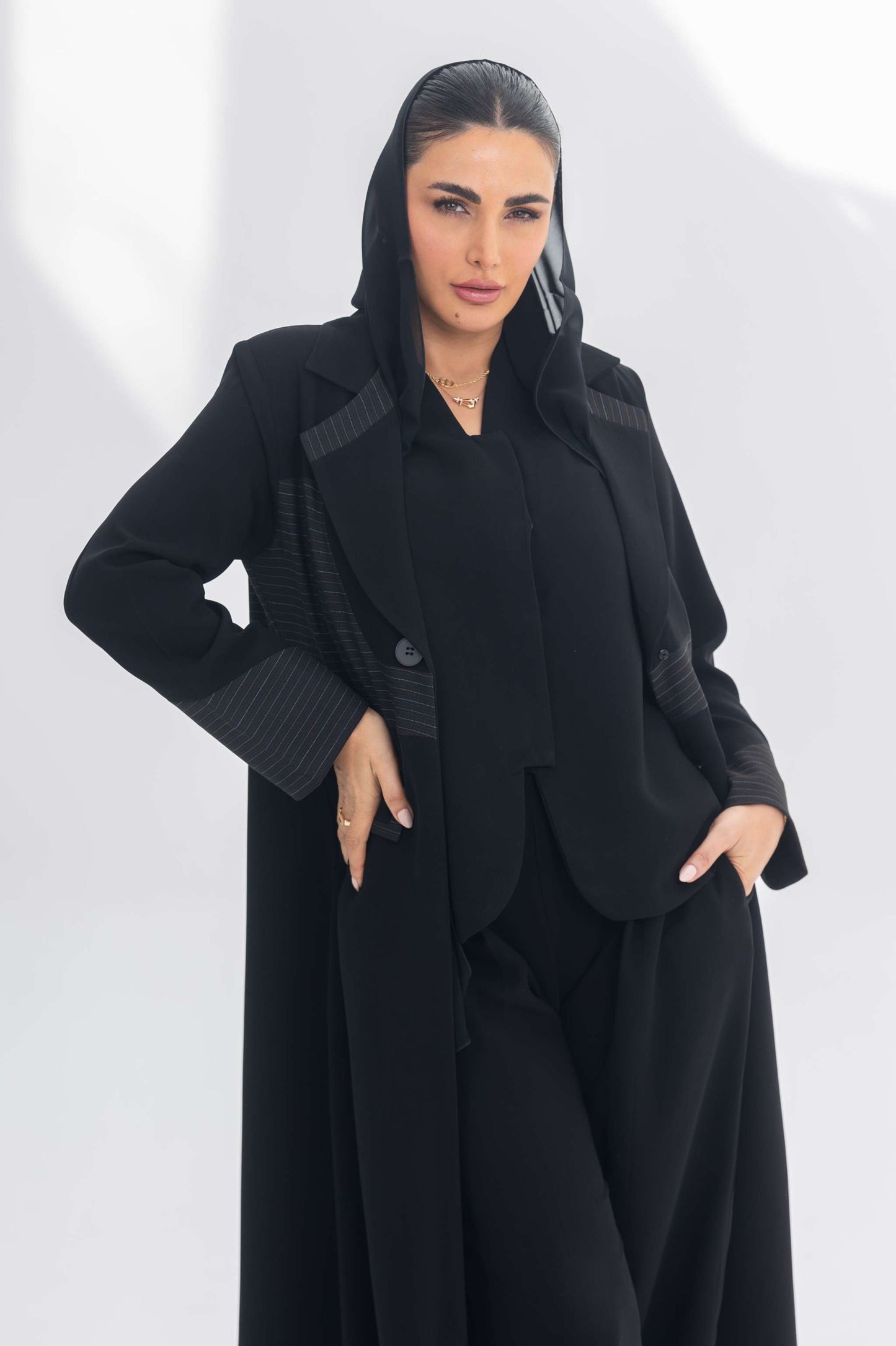 Elegant black crepe blazer abaya with contrasting textured fabric for a sophisticated and versatile look