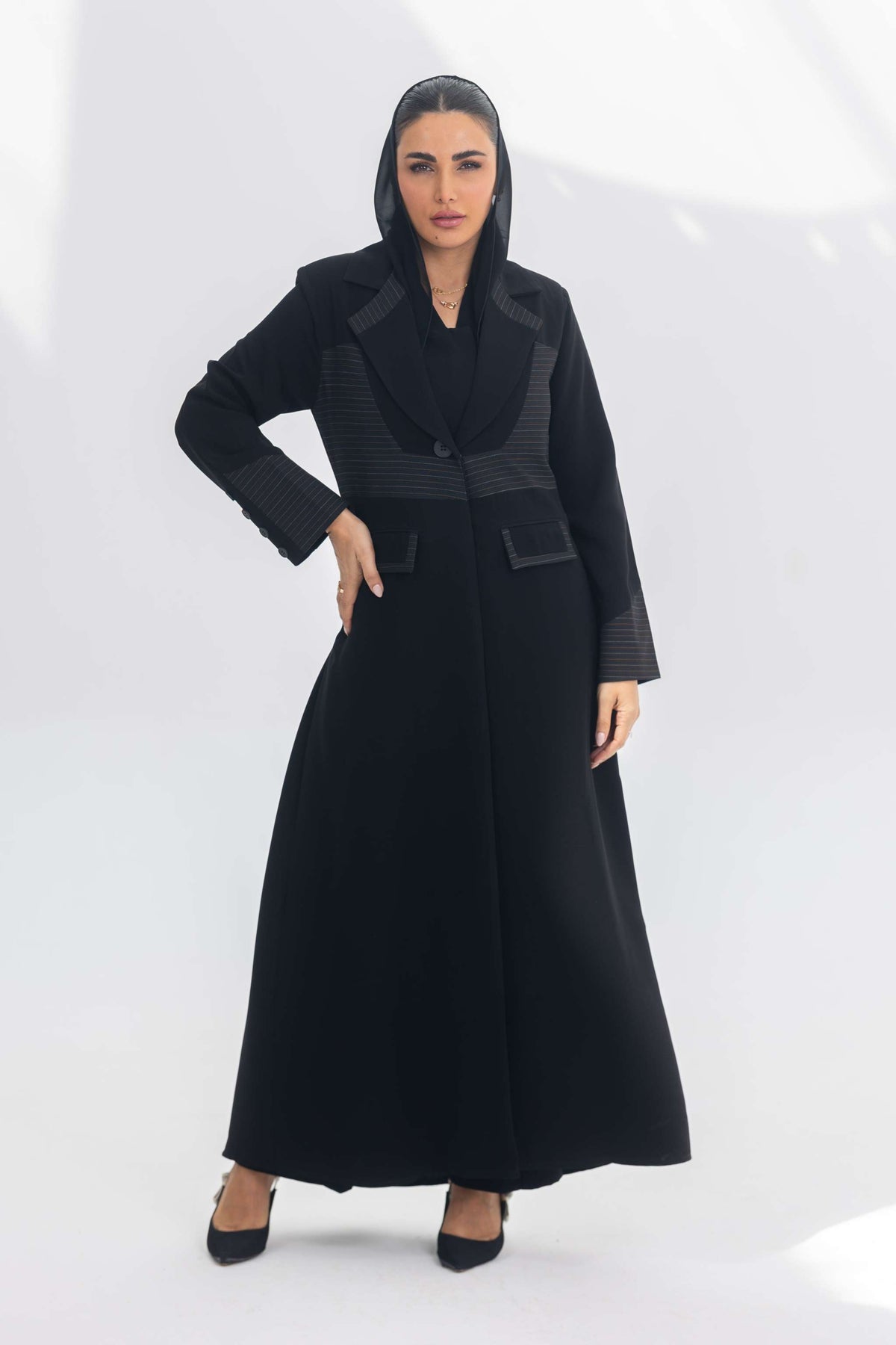 Black crepe blazer abaya with contrasting fabric detail, modern elegant silhouette for daily and formal wear.