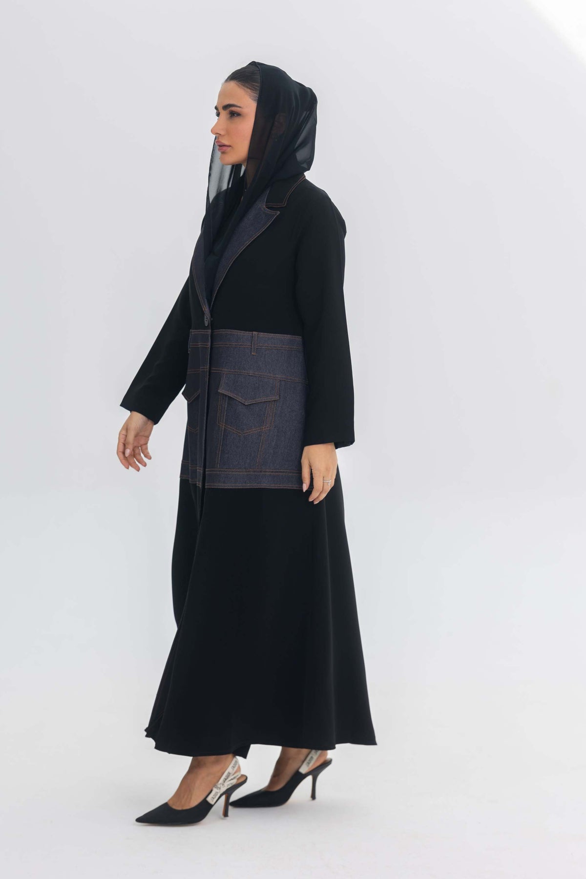 Modern black crepe abaya with blue denim stitch detailing and hooded design