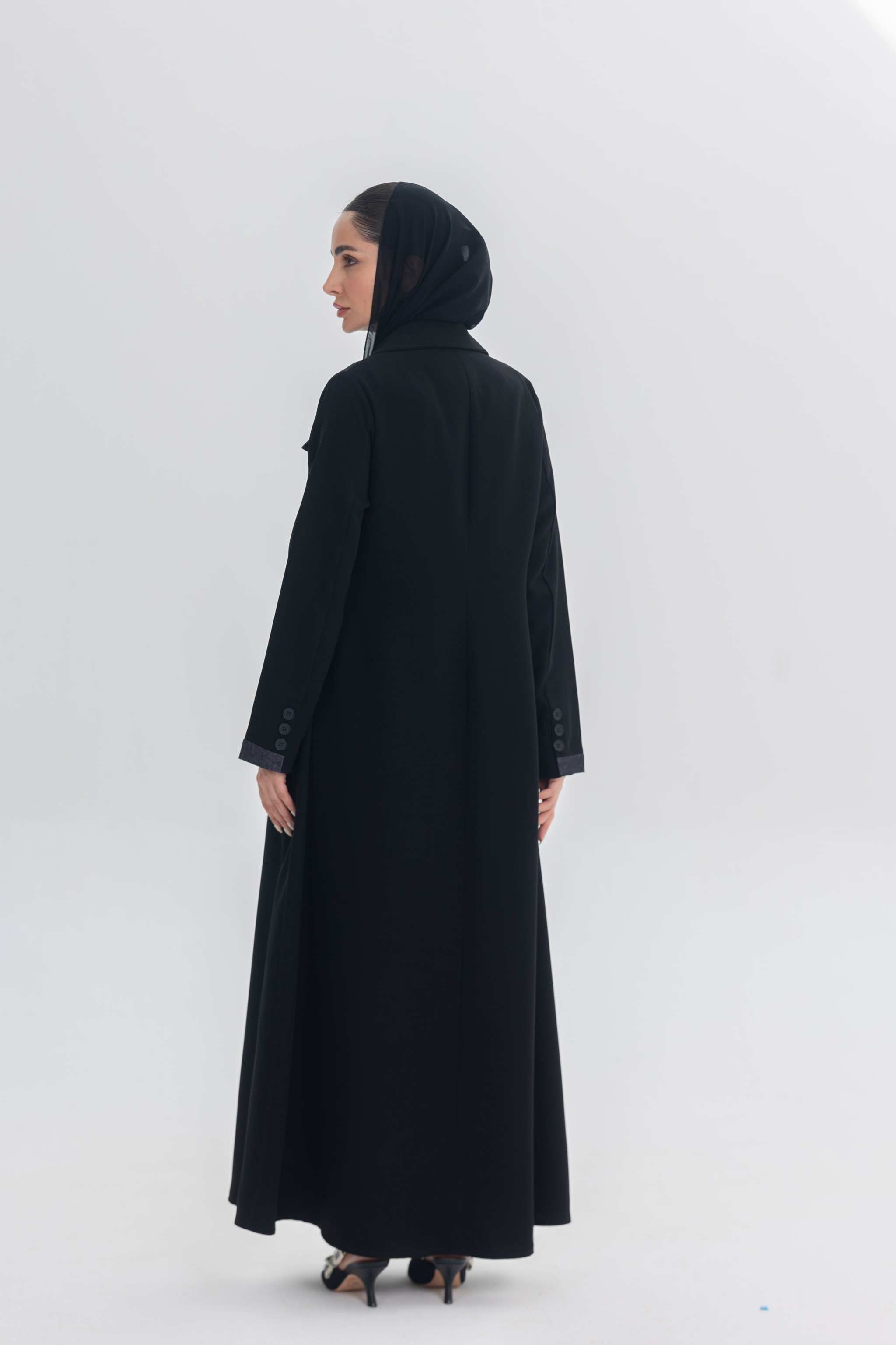 Black crepe abaya with denim accents worn by woman in headscarf, modern modest fashion Denim Veil