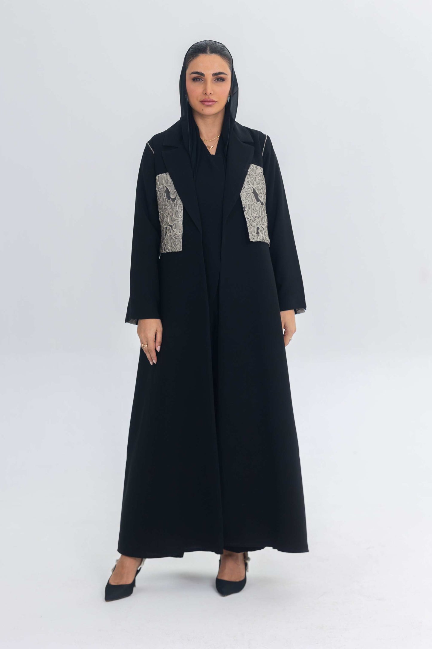 Elegant black crepe abaya with textured jacquard panels for a modern, sophisticated look