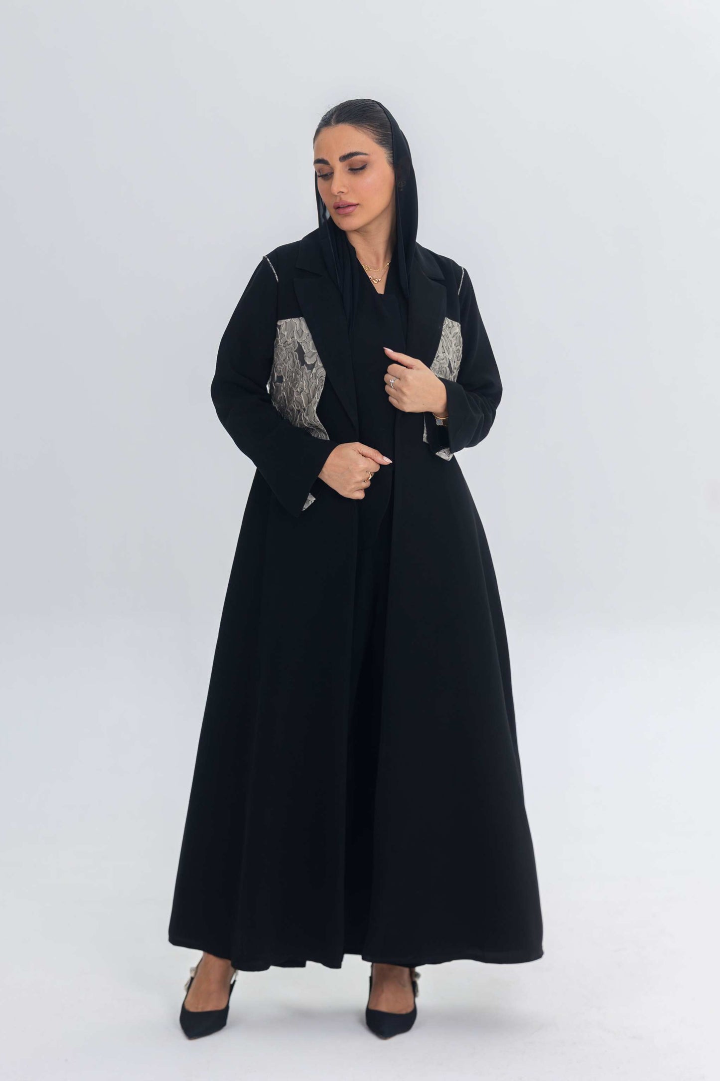 Elegant black crepe abaya with jacquard panel detailing, long flowing design for modern women