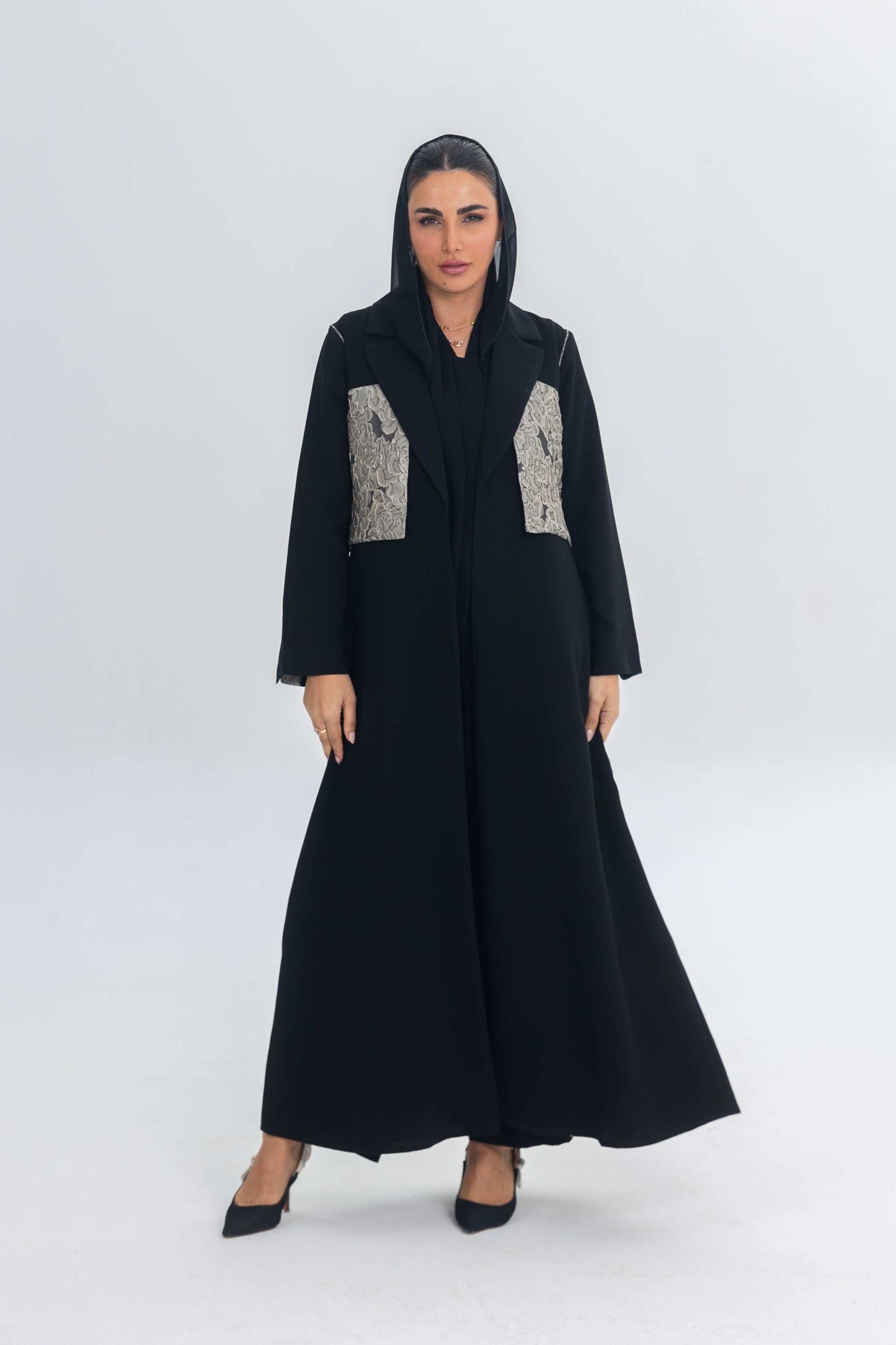 Elegant black crepe abaya with jacquard panel detailing and flowing silhouette