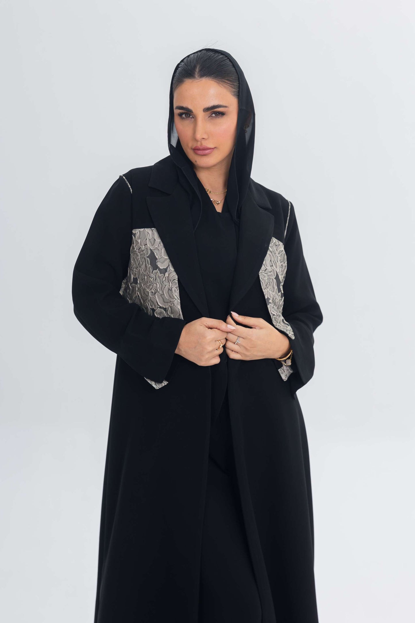 Elegant black crepe abaya with textured jacquard panel for contemporary luxury and timeless style