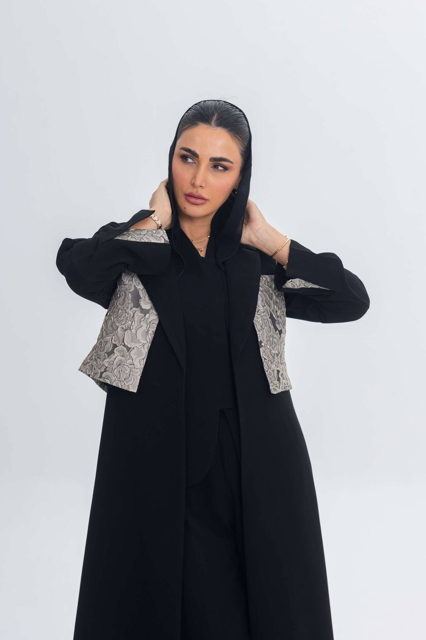 woman wearing elegant black crepe abaya with jacquard panel detailing
