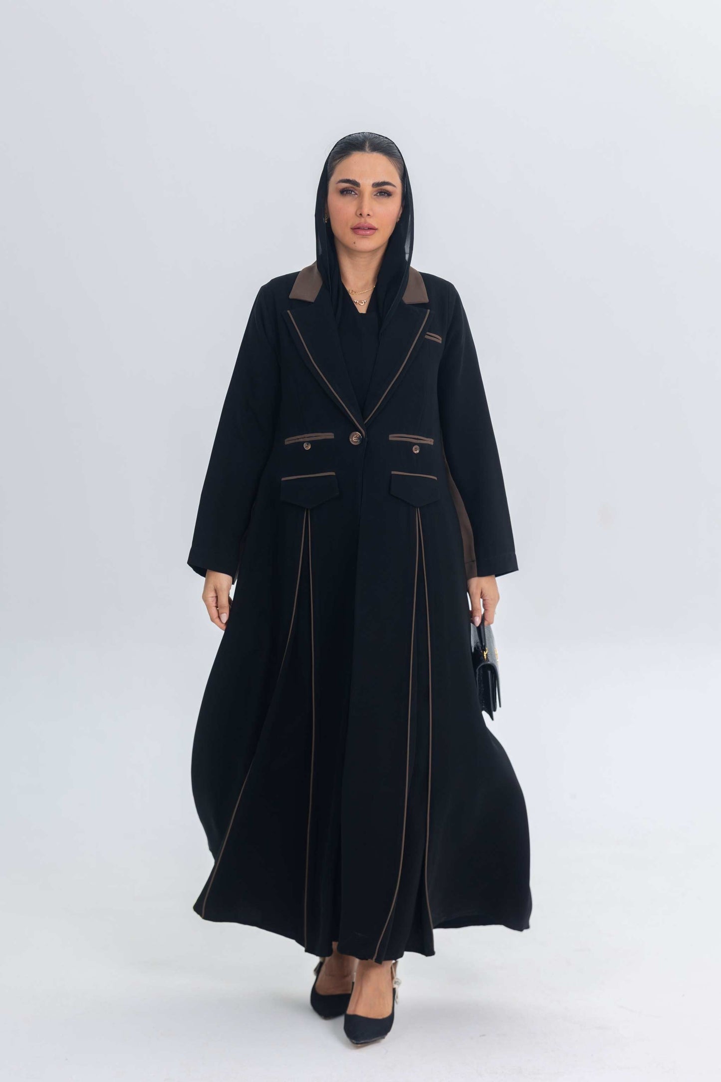 Black crepe blazer abaya with brown accents and sleek tailored fit on model