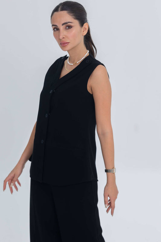 Woman wearing black sleeveless crepe inner set for modest layering and effortless elegance