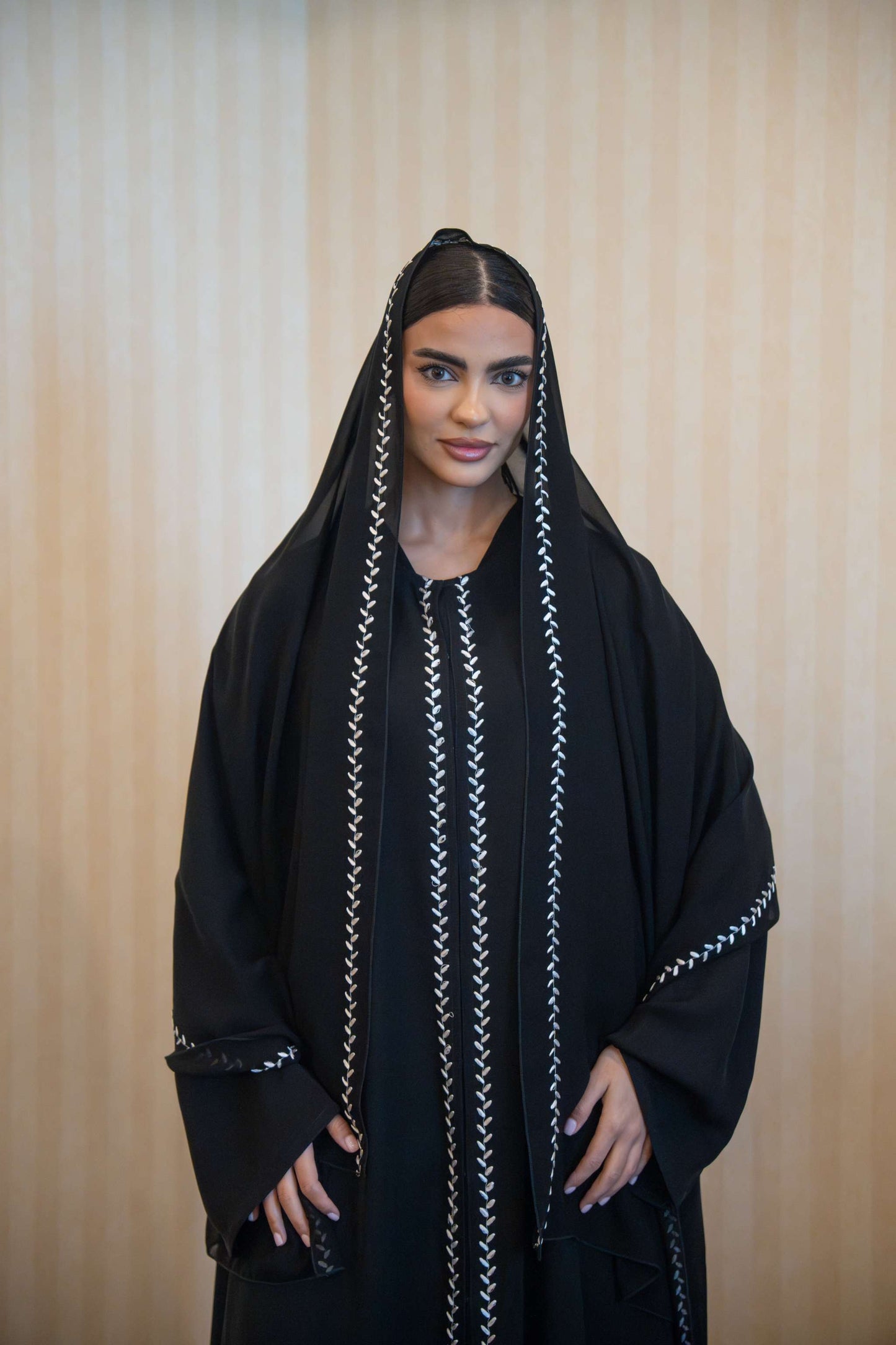 Black Echo abaya with white embroidery, straight cut, front buttons, and matching embroidered sheila.