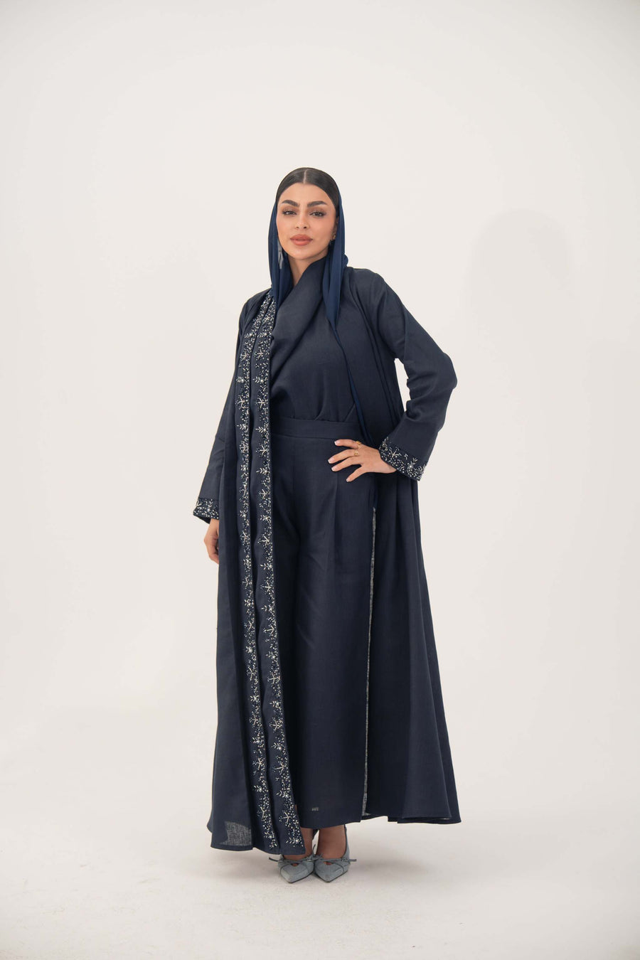 High-quality linen abaya with delicate shak beading on front panels and cuffs, open-front flowy design with structured shoulders