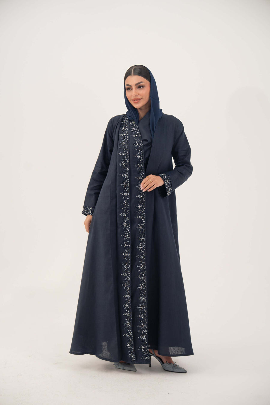 High-quality linen abaya with delicate shak beading on front panels and cuffs, open-front flowy design with structured shoulders