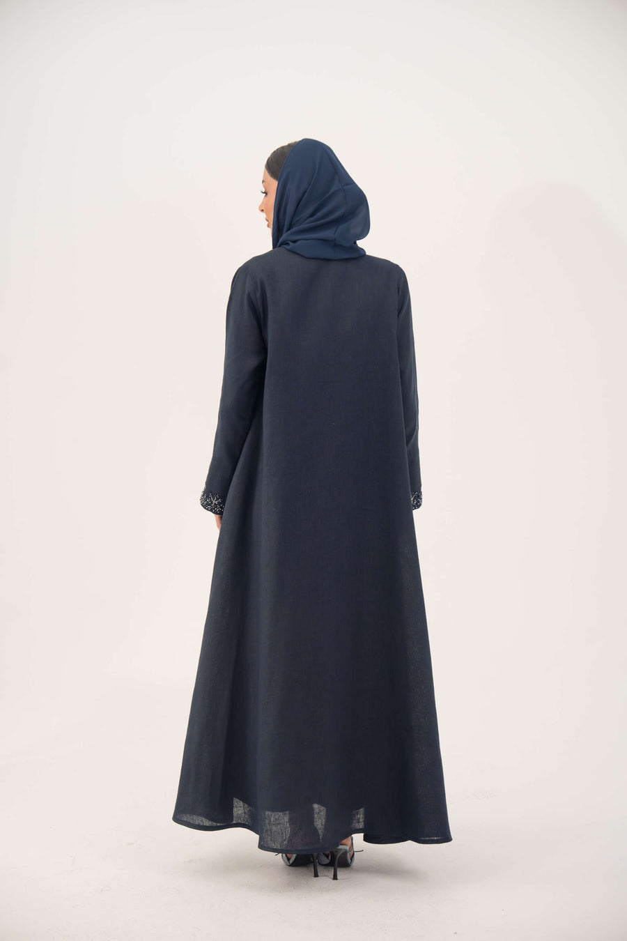 High-quality linen abaya with delicate shak beading on front panels and cuffs, open-front flowy design with structured shoulders