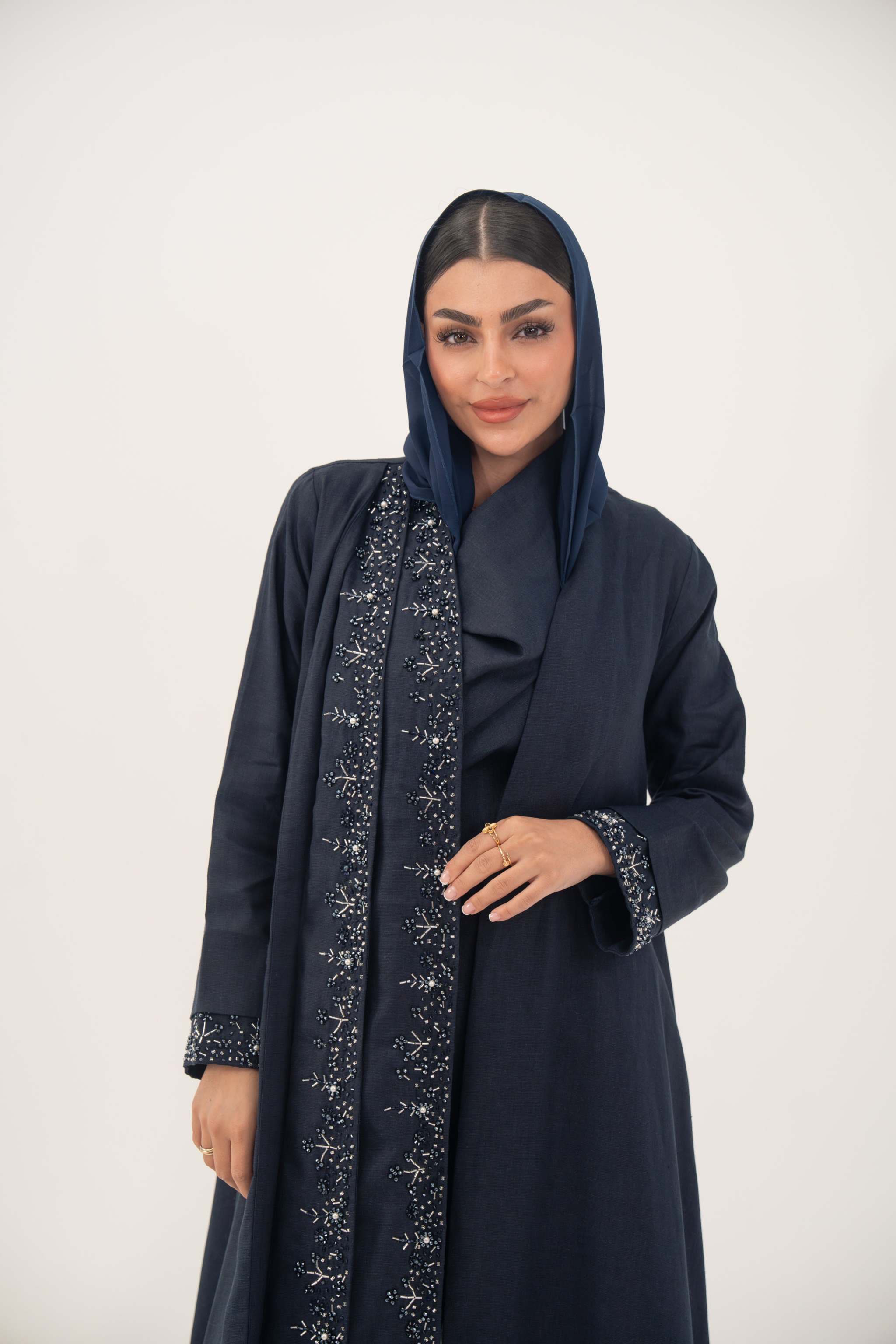 High-quality linen abaya with delicate shak beading on front panels and cuffs, open-front flowy design with structured shoulders