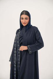 Elegant navy high-quality linen abaya with delicate shak bead embellishments on front panels and cuffs, featuring an open-front, flowy design and structured shoulders.