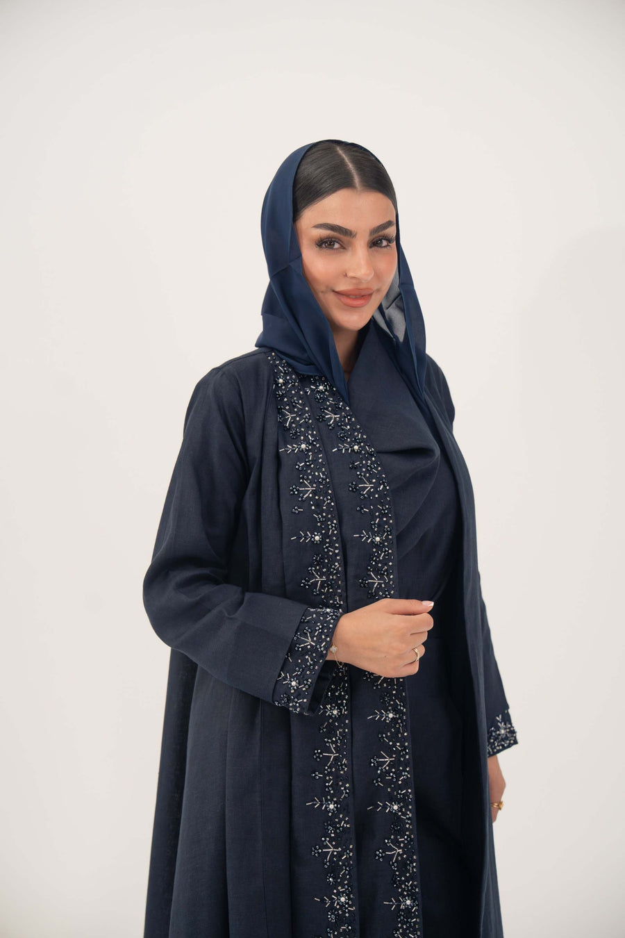 High-quality linen abaya with delicate shak beading on front panels and cuffs, open-front flowy design with structured shoulders
