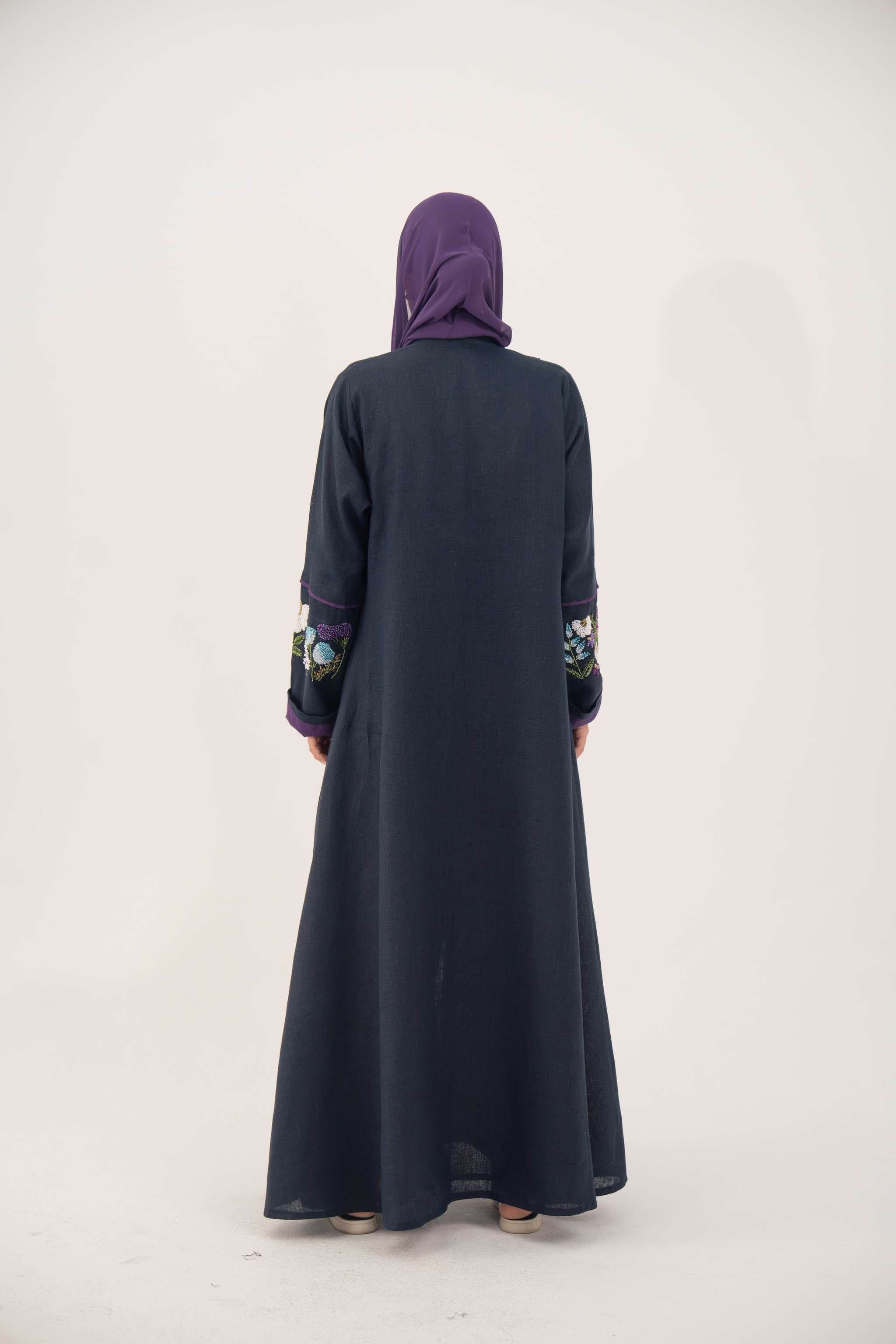 Blackberry navy blue linen-blend abaya with purple cuffs and hand-stitched floral embroidery