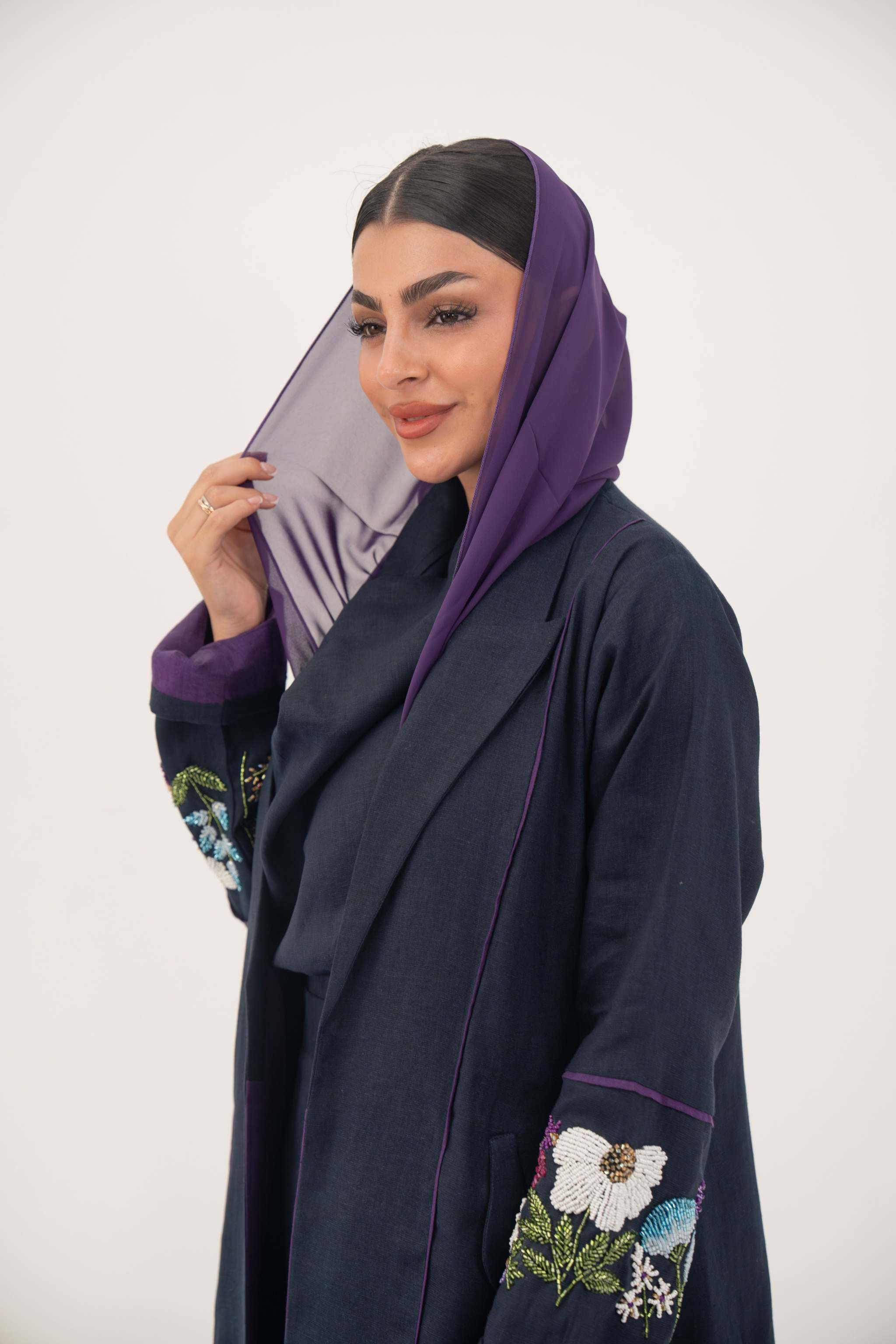 Blackberry navy blue linen-blend abaya with purple cuffs and hand-stitched floral embroidery