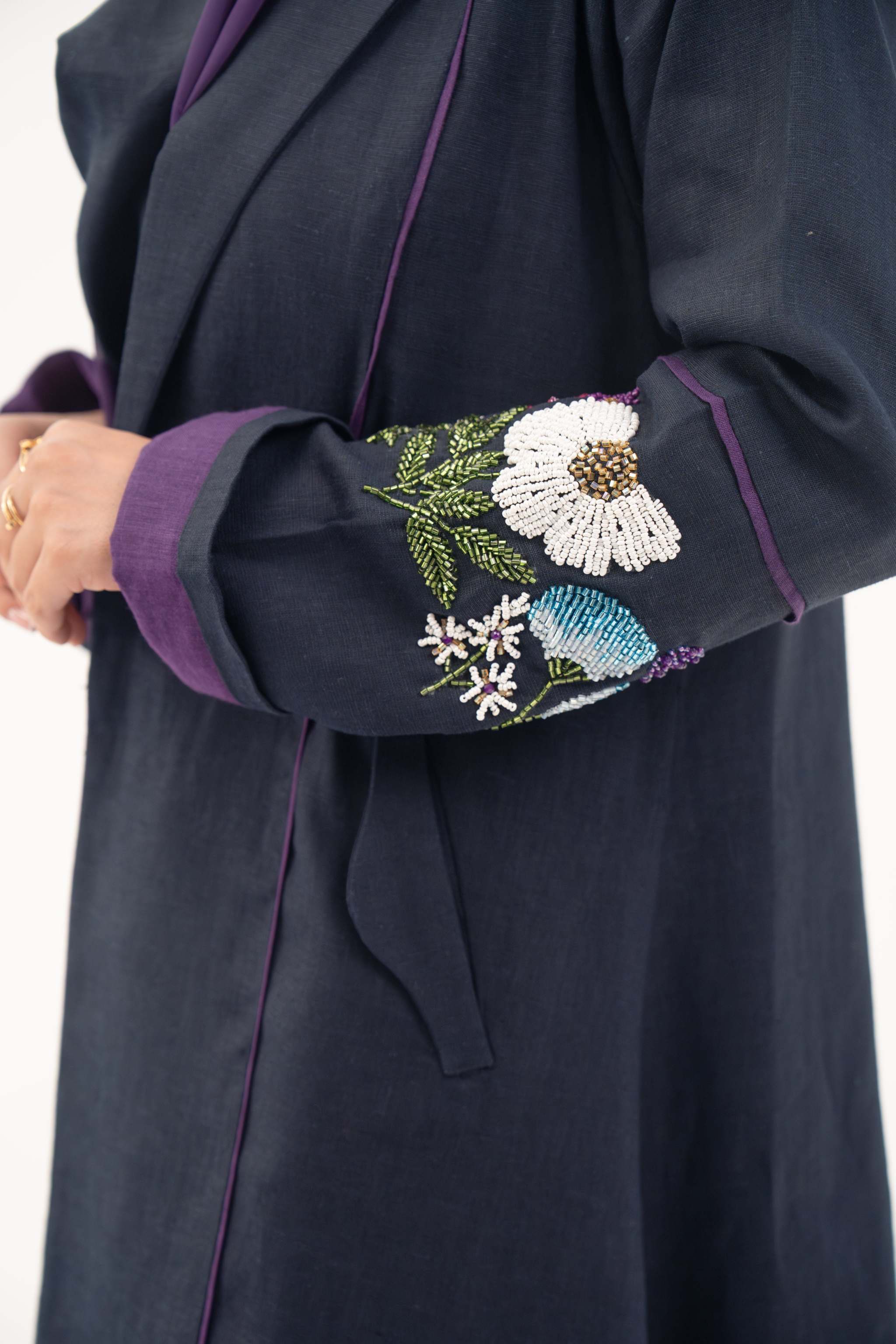 Blackberry navy blue linen-blend abaya with purple cuffs and hand-stitched floral embroidery