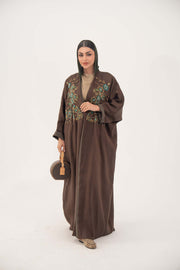 Brown bisht abaya with turquoise and gold floral embroidery and lightweight chiffon lining for elegant special occasions.