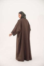 Brown bisht abaya with turquoise and gold floral embroidery, lightweight chiffon lining, and loose elegant fit.