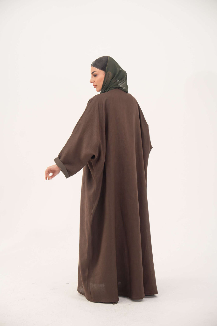 Brown bisht abaya with turquoise and gold floral embroidery, lightweight chiffon lining, and loose elegant fit.