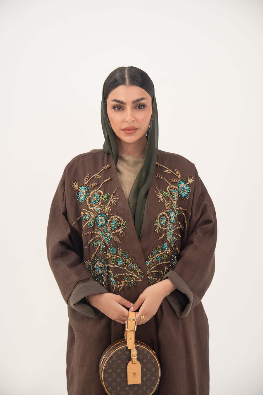 Choco Mint bisht abaya in warm brown with turquoise and gold floral embroidery, lightweight chiffon lining, elegant loose fit for special occasions
