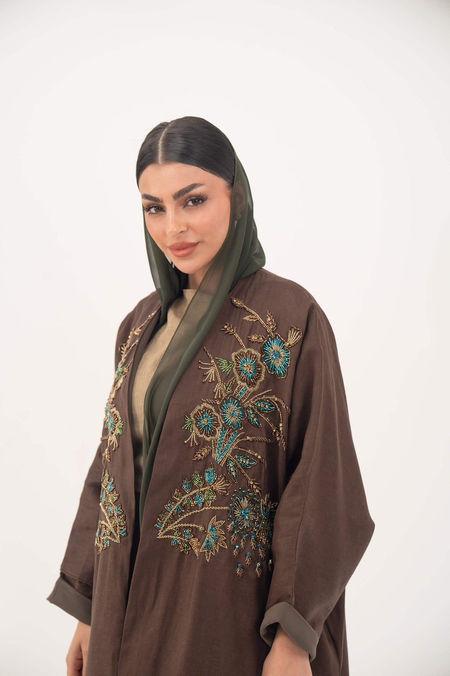 Brown bisht abaya with turquoise and gold floral embroidery and lightweight chiffon lining for elegant special occasions