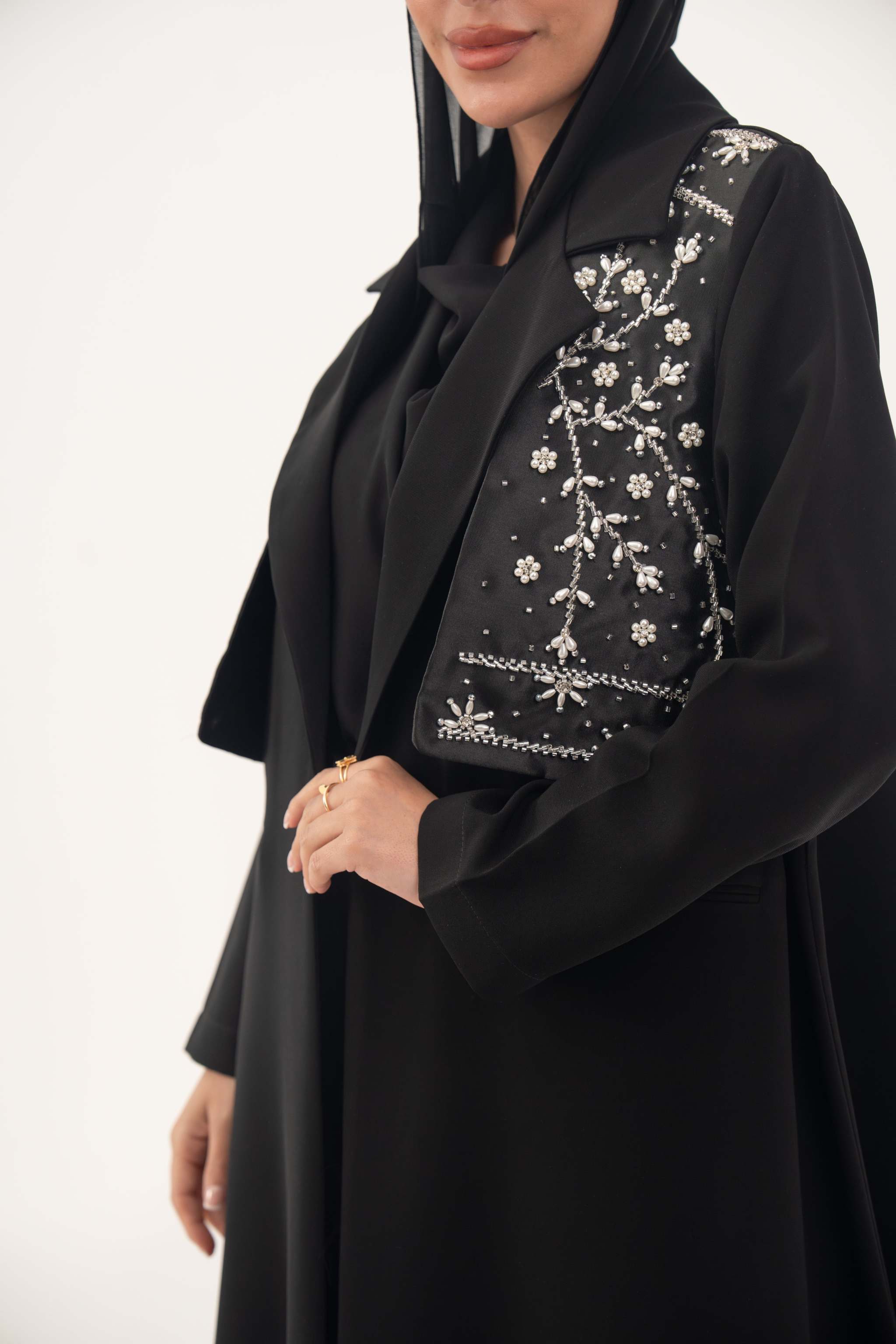 Black Layal blazer abaya with satin vest layer and crepe fabric, featuring a notched collar and structured shoulders