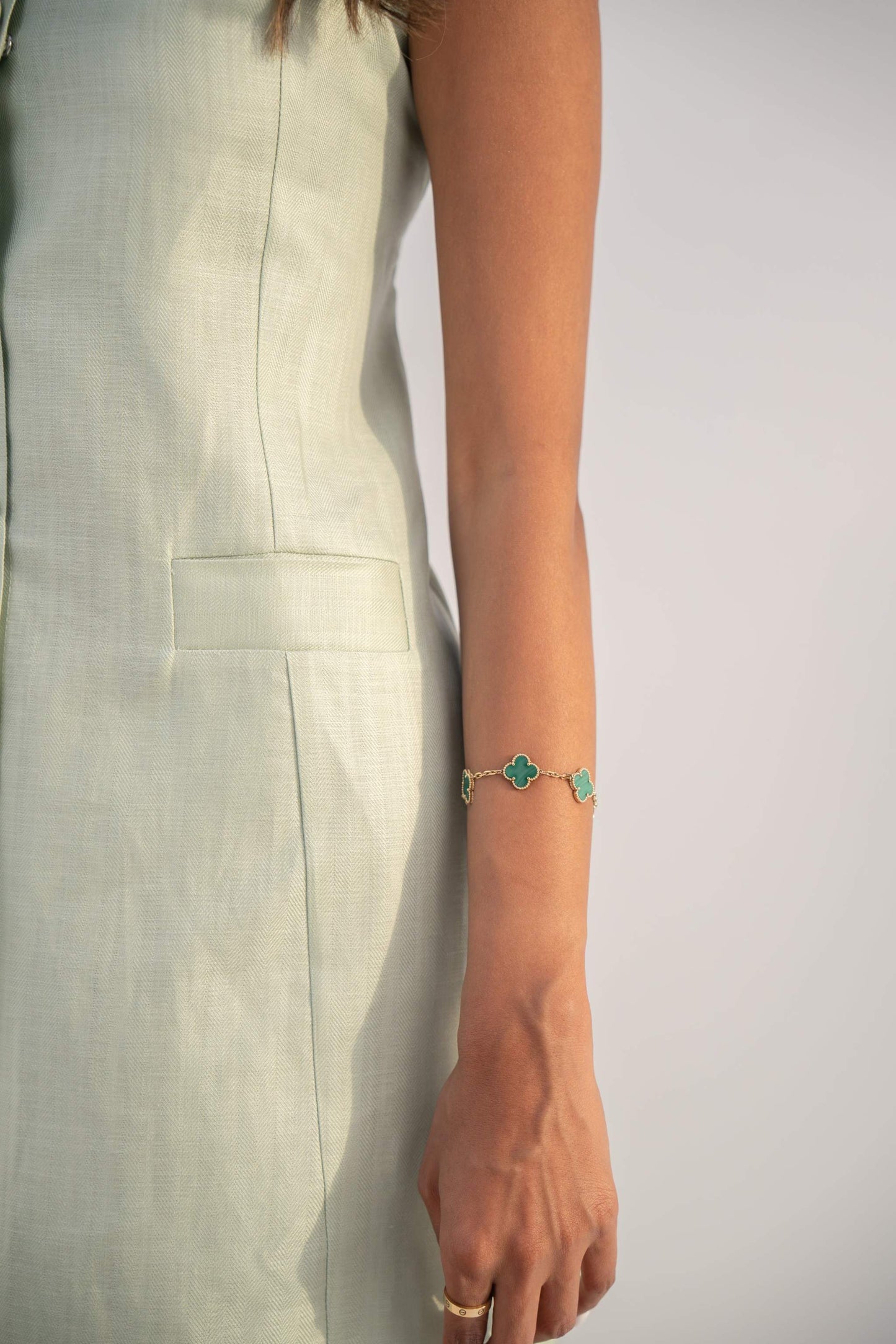 Sleeveless peppermint green inner dress in twill linen blend with front button closure and straight cut design.