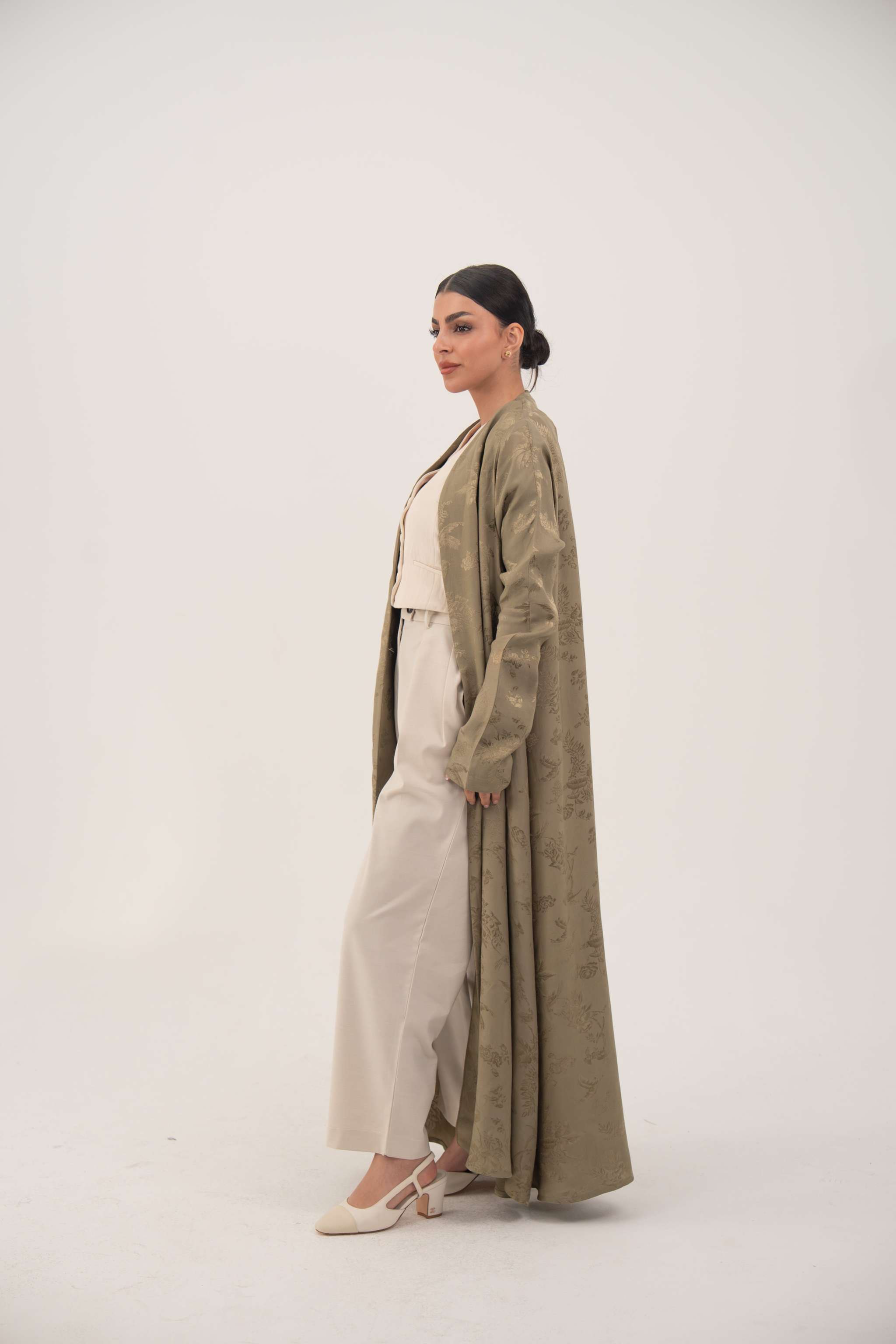 Elegant olive green silk abaya with open-front and ruched wrist sleeves for a sleek look