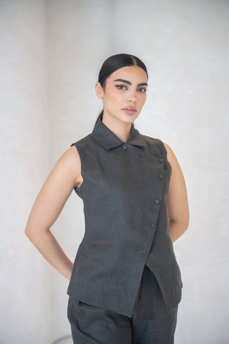 woman wearing charcoal gray vest with asymmetrical button front and collar
