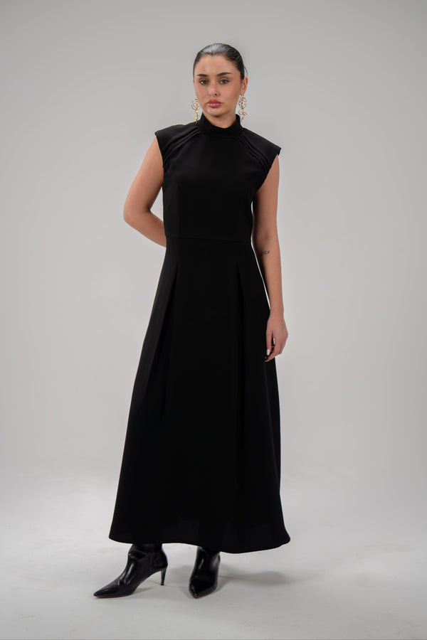 Elegant black crepe dress with pleated sleeves, soft fabric, and modest style for everyday and special occasions.