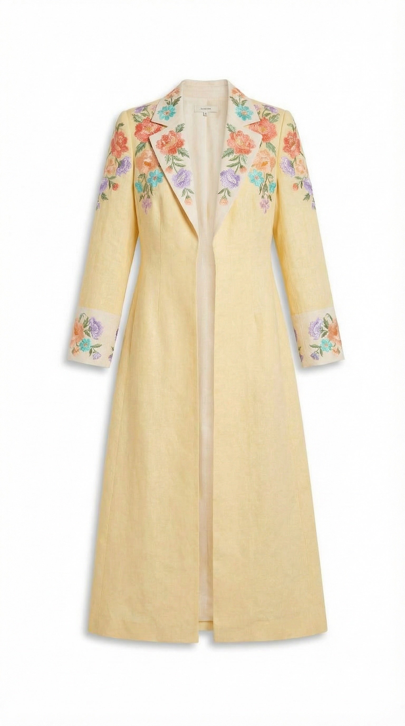 Yellow coat with floral embroidery on a white background