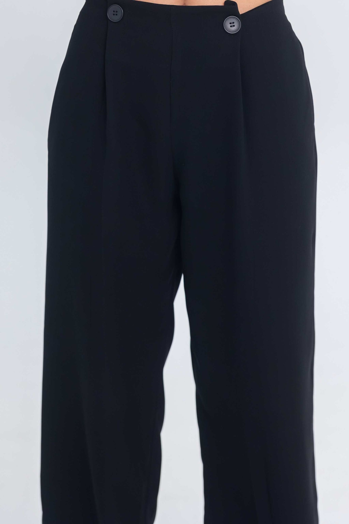 Black Inner Code pant with button details on the waistband