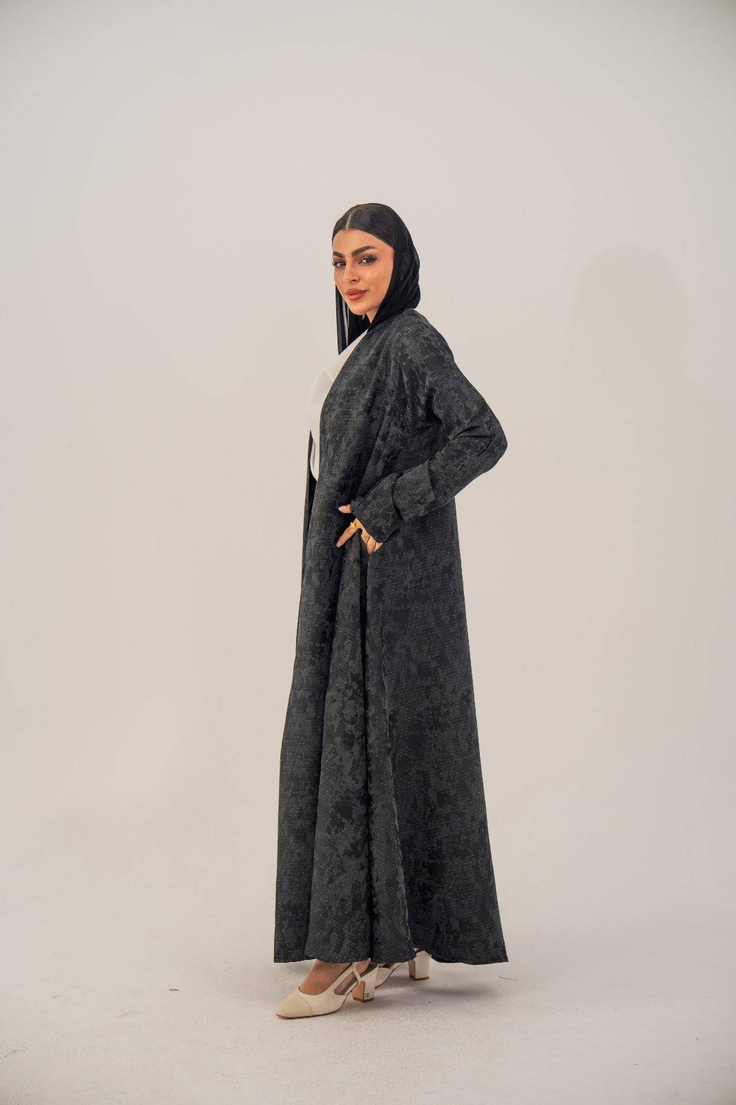 Black silk open-front abaya with subtle abstract woven pattern and light shimmer in charcoal gray finish