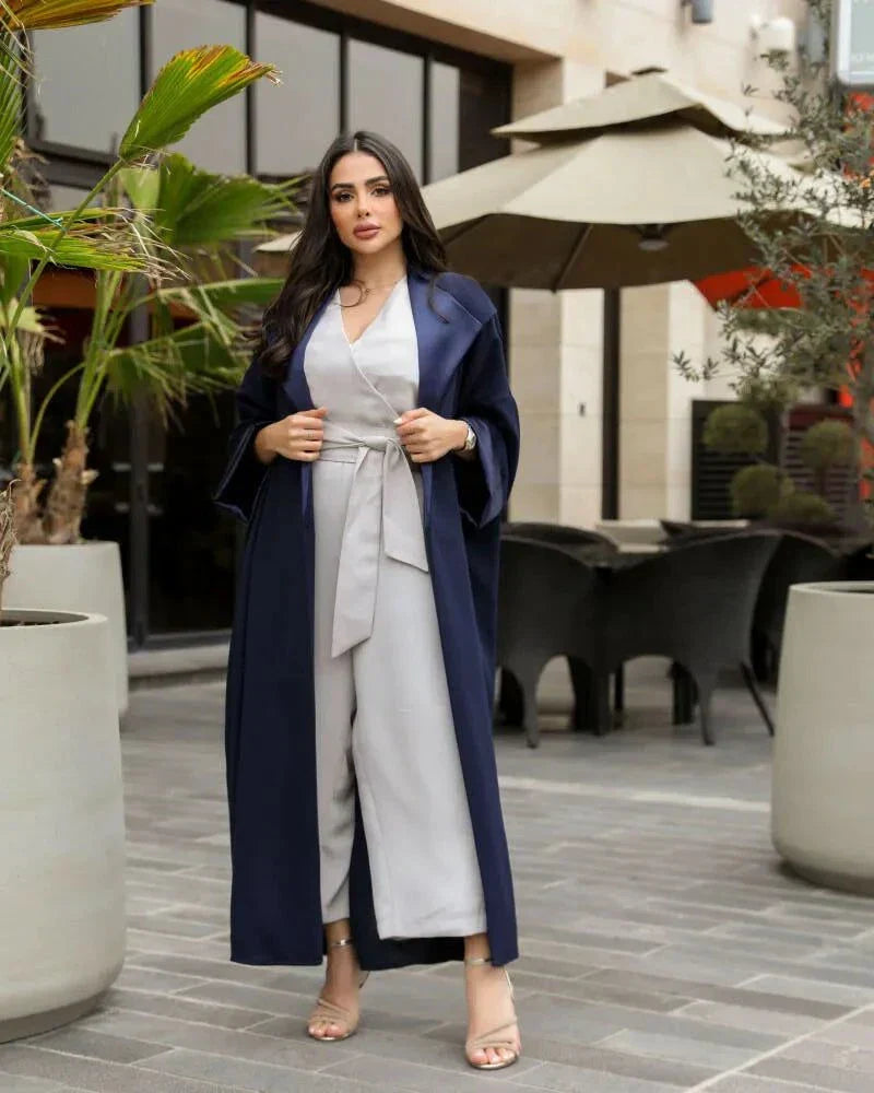 Woman wearing a deep navy blue freesize blazer with crepe and mokado fabrics outdoors
