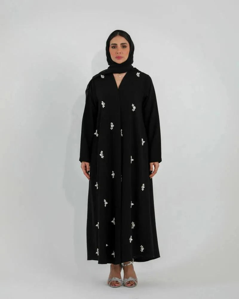 Black Luluwa abaya in soft crepe with hand-embroidered pearl-inspired details and a simple straight cut.